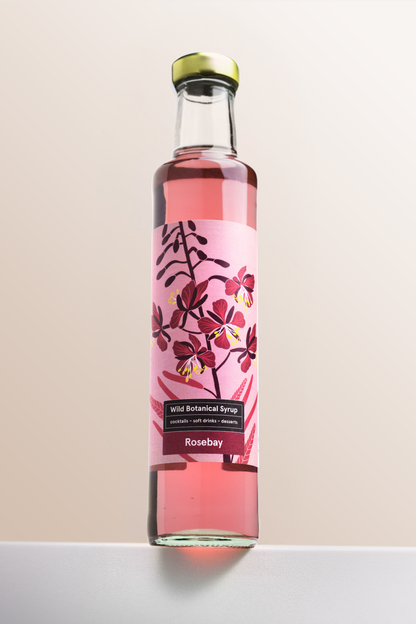 rosebay botanical syrup by highland boundary in pink floral bottle