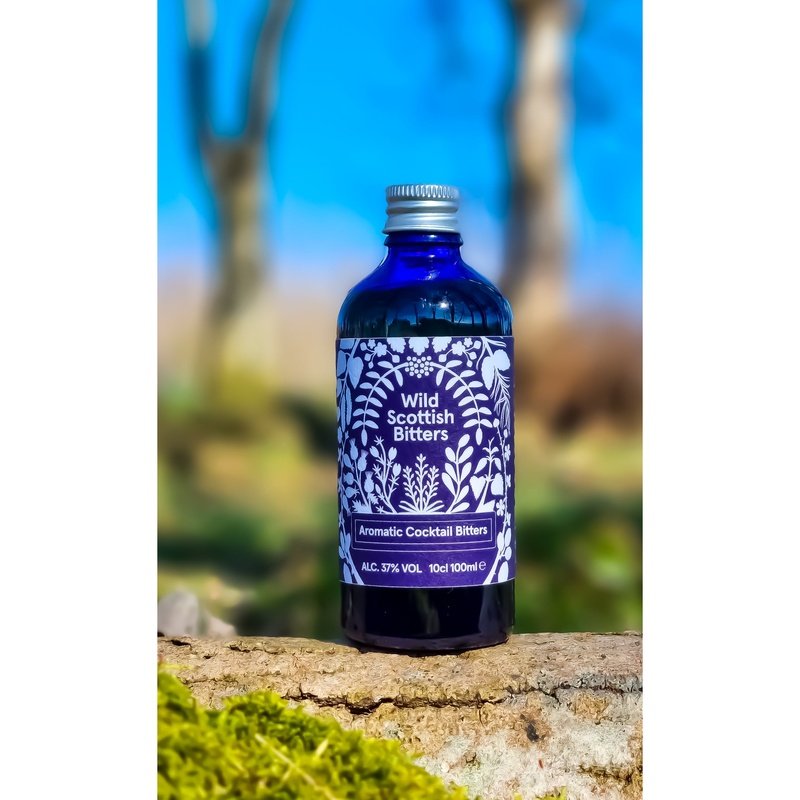 Highland Boundary Wild Scottish Bitters | Aromatic Bitters in the wilderness on a mossy log